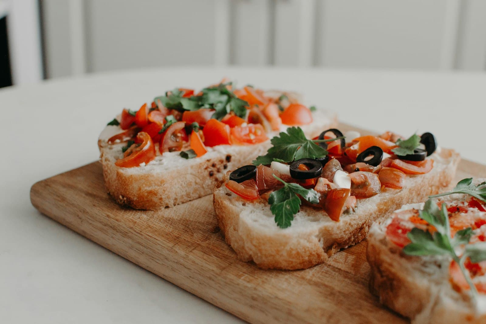 A platter of freshly assembled tomato bruschetta